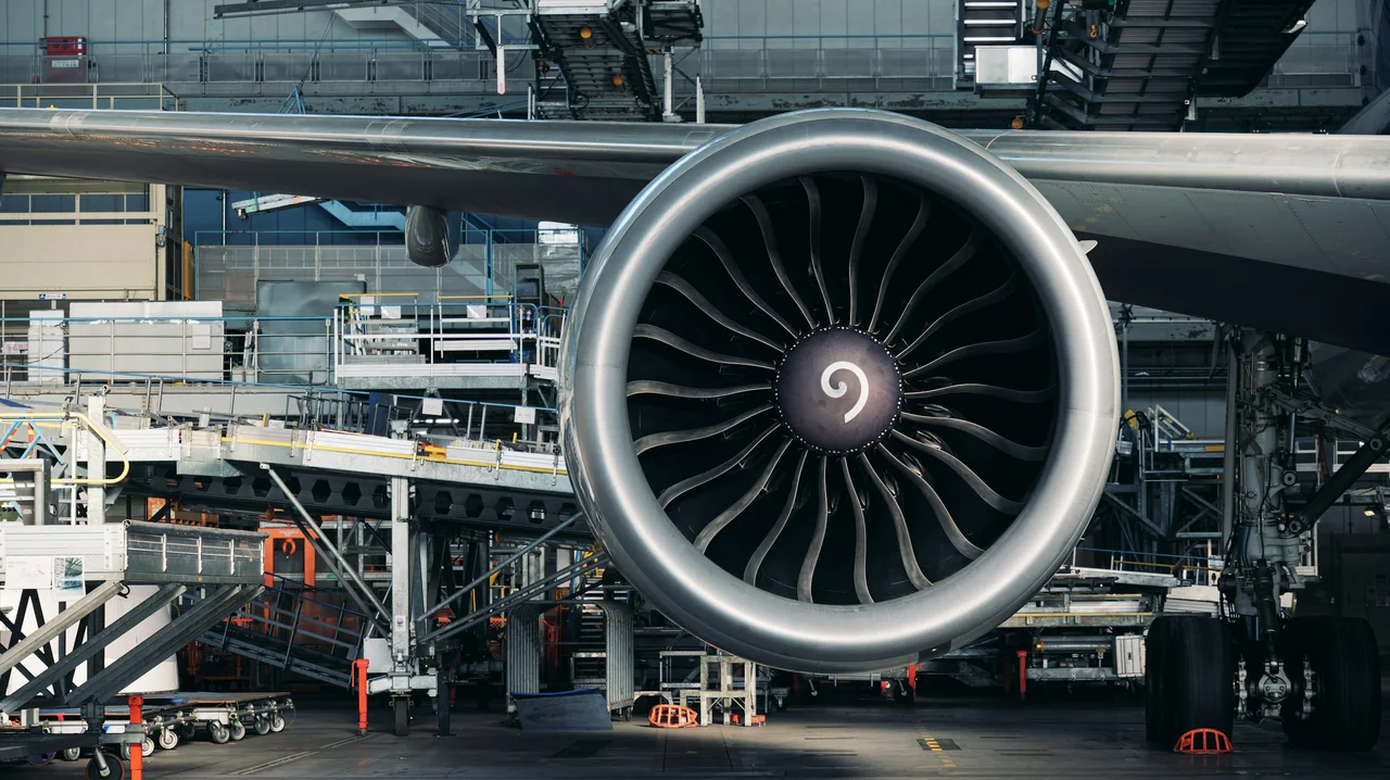 Aircraft engine and wing inside a maintenance hangar